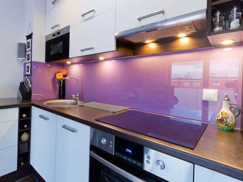 Picture of a beautiful purplish pink coloured splashback, looks very nice with a glassy feel yet shiny and coloured